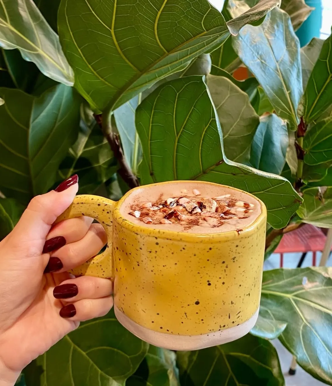 Hot chocolate with toppings in a yellow speckled mug