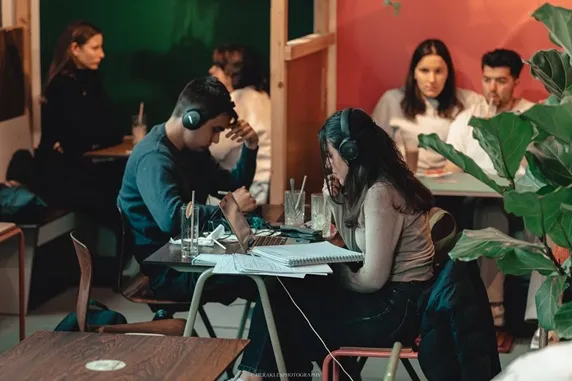Students working at The Unusual — laptop friendly cafe in Brussels